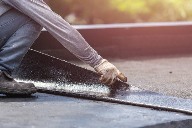 Professional Waterproofing technician working in Watertown, NY